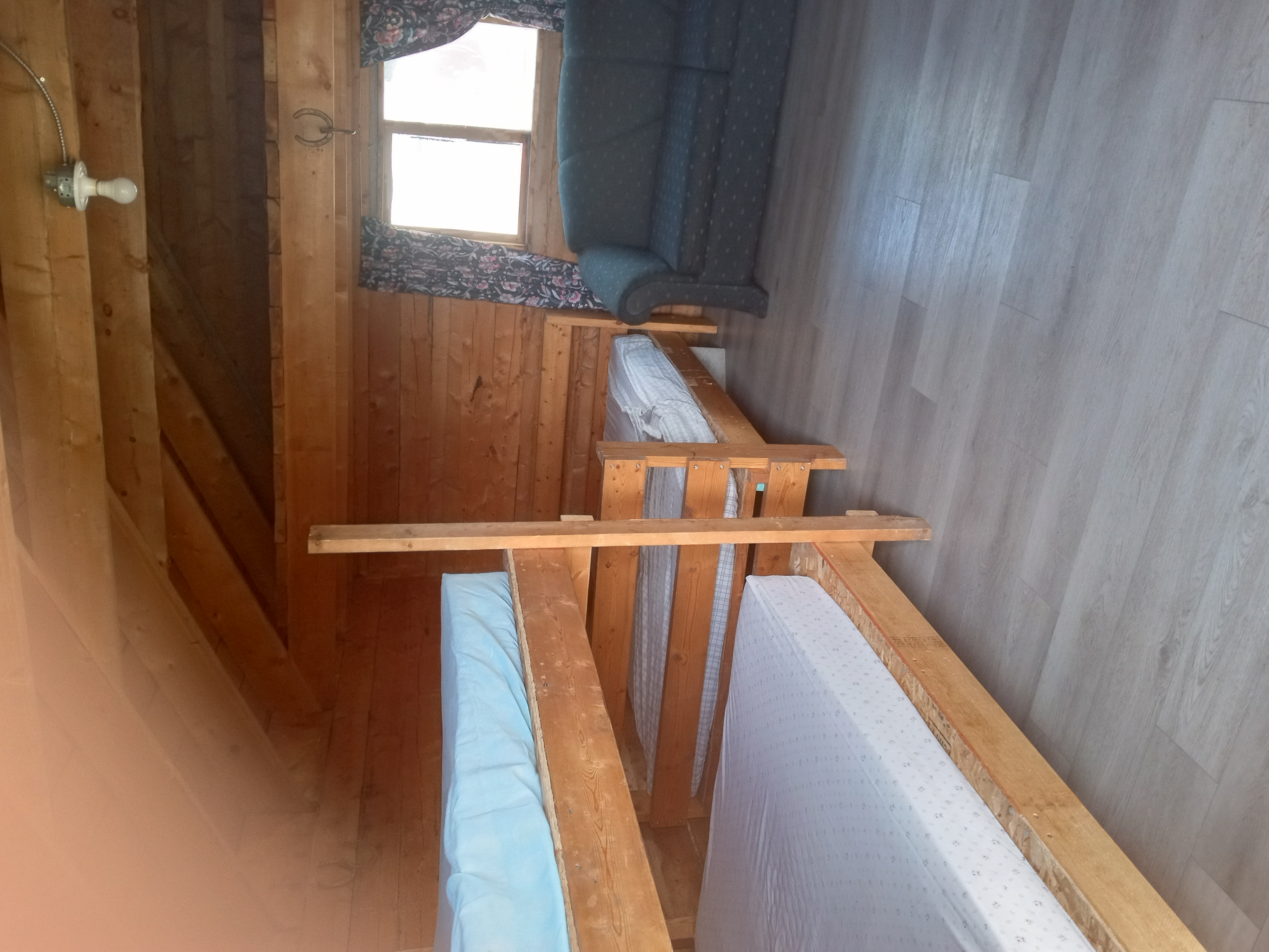 Rustic cabin bunk beds at Barrier Mountain Outfitters
